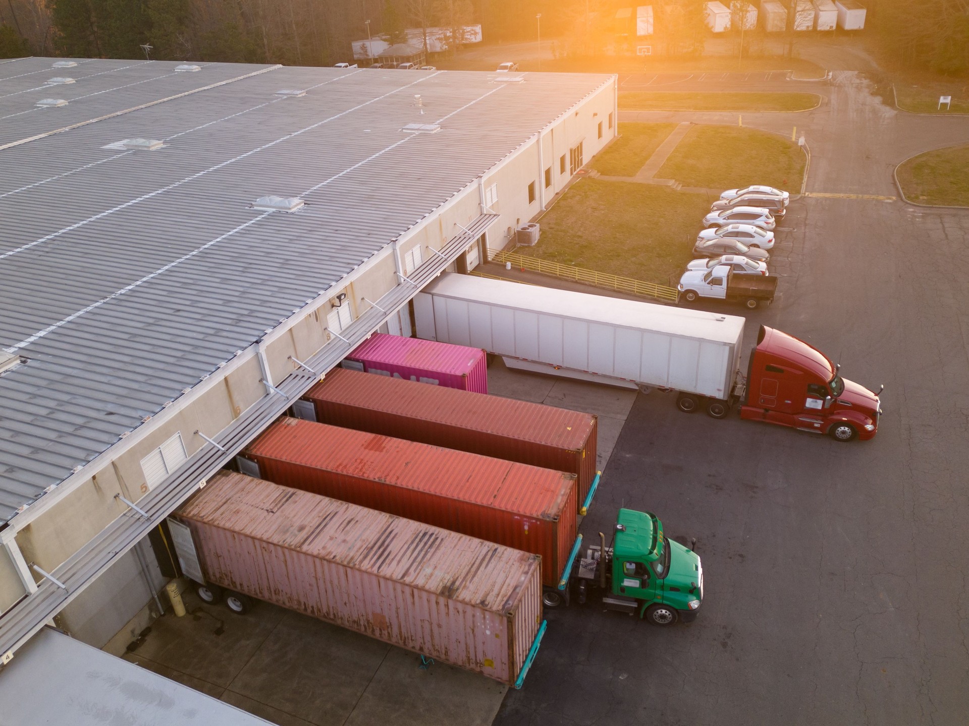 Trucks loading and unloading in warehouse